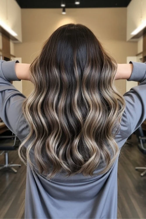 back of female's head with ash blonde balayage hair