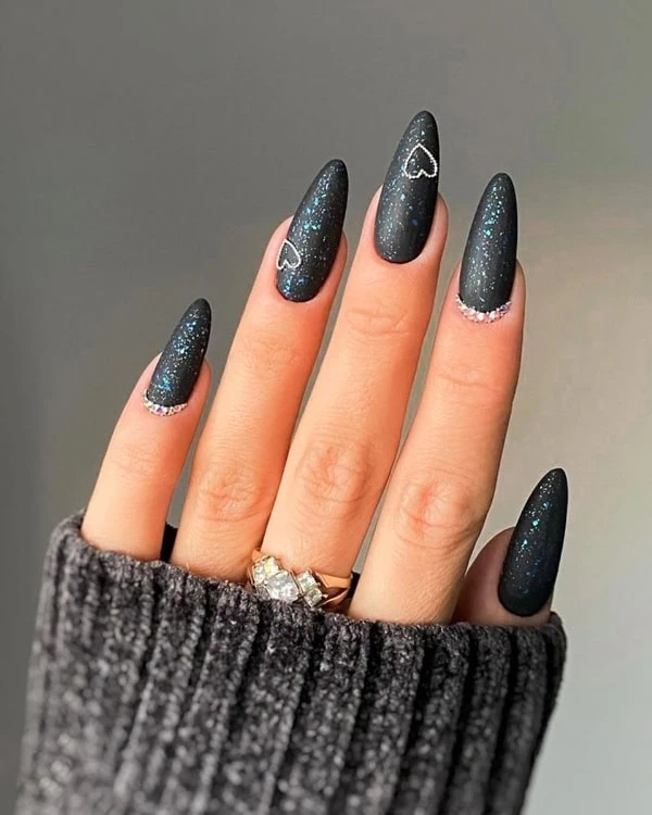 hand with trendy black nails