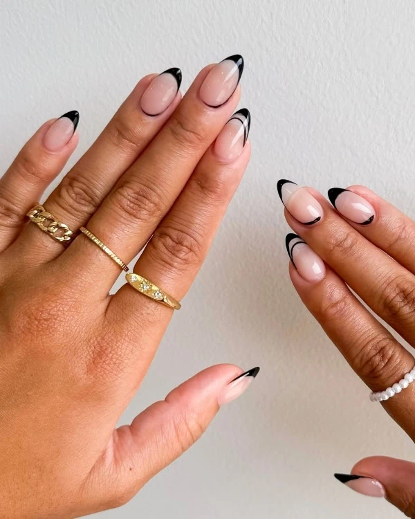hands with modern simple black nail designs