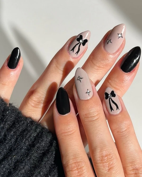 hands with Black Coquette Nails with Bows