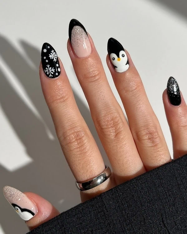 hand with holiday themed black nails