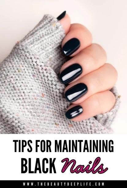 hand with shiny black nail polish and text overlay - Tips For Maintaining Black Nails