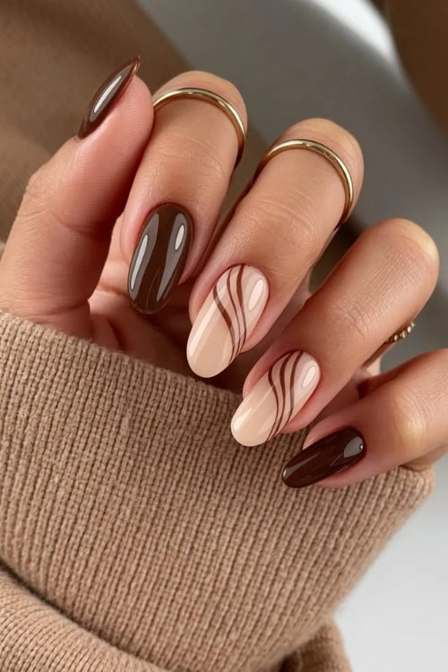 hand with mocha waves brown nails