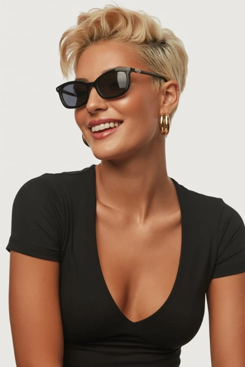 woman with a blonde pompadour pixie cut