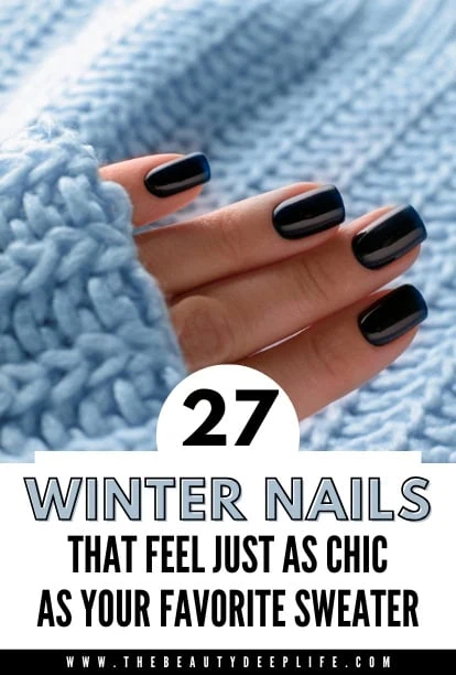 Dark winter nails with blue polish on a winter sweater background, stylish and trendy nail art for cold weather.