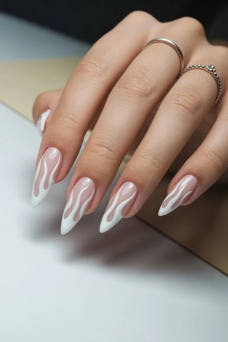 Elegant white and nude drip nail art with long stiletto-shaped acrylic nails, showcasing trendy manicure design, perfect for beauty and skincare enthusiasts.