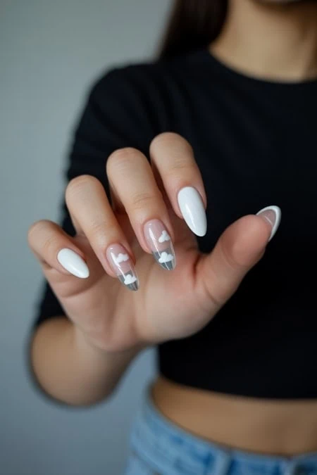 Elegant white and transparent gel nail design with heart accents, perfect for beauty and manicure enthusiasts. Showcasing trendy nail art for a chic, stylish look.
