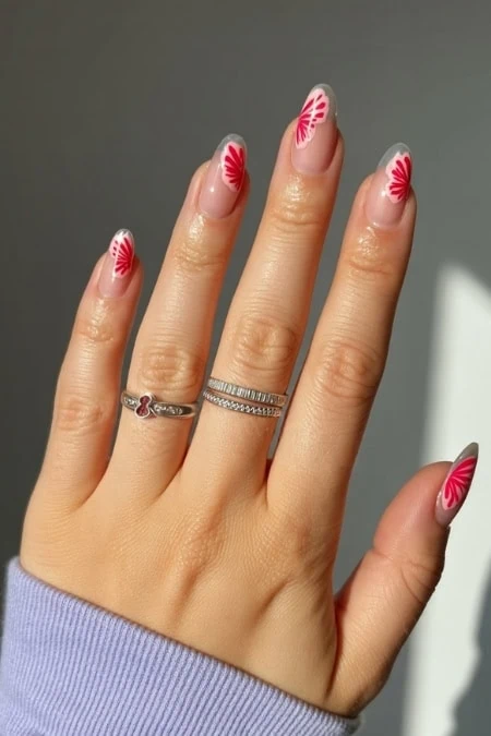 Elegant butterfly nail art with pastel purple and peach tones on almond-shaped nails, featuring detailed butterfly designs for a trendy and delicate look.