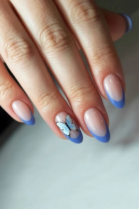 Elegant butterfly nail art with pastel purple and peach tones on almond-shaped nails, featuring detailed butterfly designs for a trendy and delicate look.
