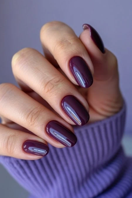Polished burgundy gel nails with glossy finish, perfect for beauty and nail art enthusiasts.
