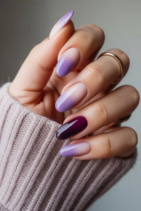 Elegant ombre coffin nail art with purple and lilac shades, showcasing trendy gel manicures, perfect for beauty and skincare enthusiasts.