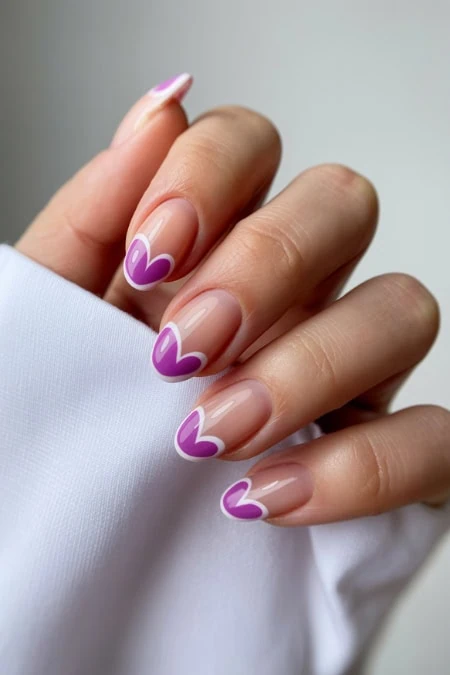 Elegant manicure with purple heart nail art on natural nails, showcasing creative nail design and beauty care. Perfect for stylish, trendy looks and professional salon treatments.