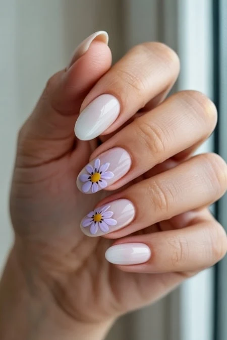 Stylish manicured nails with white polish and delicate daisy flower nail art, showcasing a beautiful and trendy nail design for beauty and self-care.