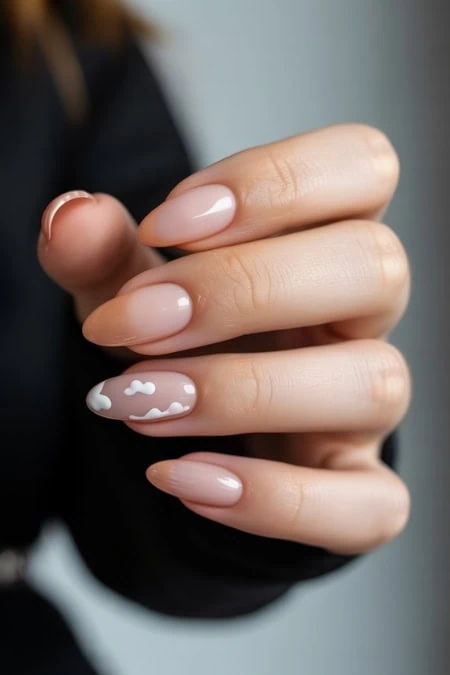 Elegant nude and white cloud nail art on manicured fingers, featuring a glossy finish and creative design, perfect for showcasing nail trends and beauty tips.