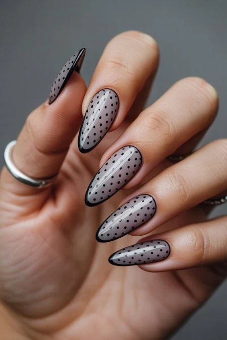 Polka dot nail art with gray and black nails, trendy manicure design for stylish and modern look.