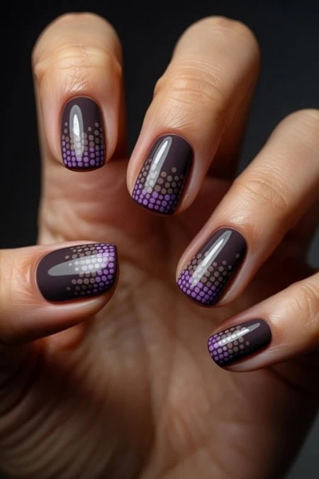 Vibrant black and purple dotted nail art design on manicured nails, close-up photo, perfect for beauty and nail art enthusiasts.