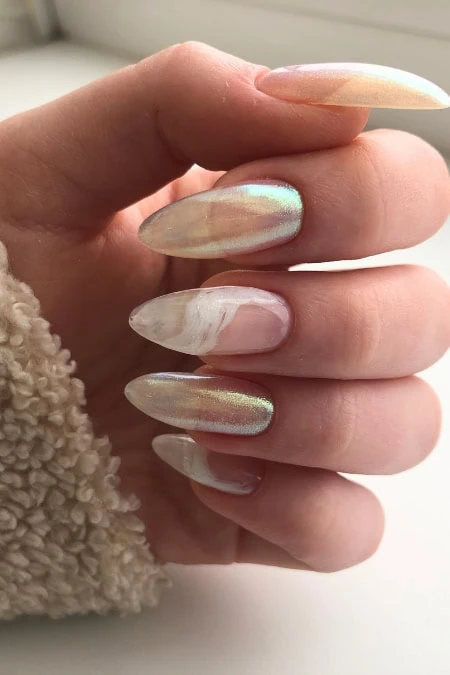 Pastel marble gel nail art with iridescent finish on almond-shaped nails, showcasing trendy, elegant manicure perfect for beauty and fashion enthusiasts.