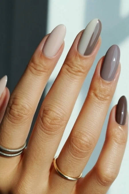 Elegant nude and taupe ombre gel manicure with glossy finish on well-manicured nails, showcasing professional nail art services at The Beauty Deep Life.