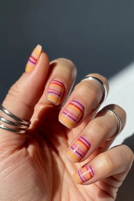 Pastel striped art manicure.