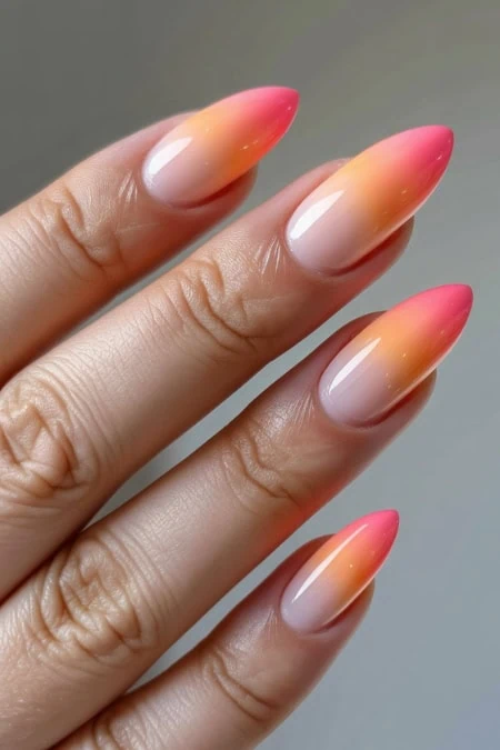 Elegant gradient nail design featuring pink and orange hues, perfect for summer nails inspiration.