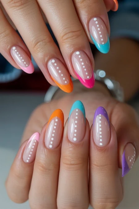 Colored nail design featuring vibrant, glossy finishes with white dotted details, perfect for a trendy and stylish Summer nails manicure.