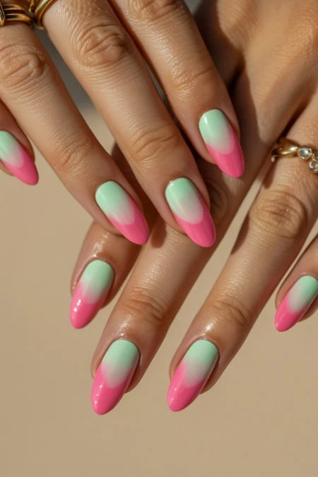 Pink and mint ombre nail art, perfect for spring and summer fashion, featuring smooth gradient transitions on well-groomed nails.
