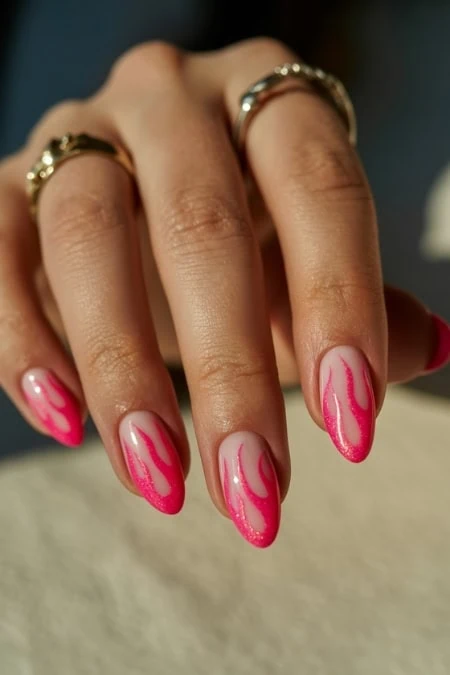 Elegant pink marble nail design on manicured fingers, highlighting trendy nail art suitable for beauty, fashion, and self-care enthusiasts.