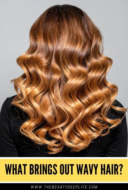 Wavy copper hair styled in loose, flowing curls, showcasing vibrant color and healthy shine, perfect for a beauty or haircare blog.