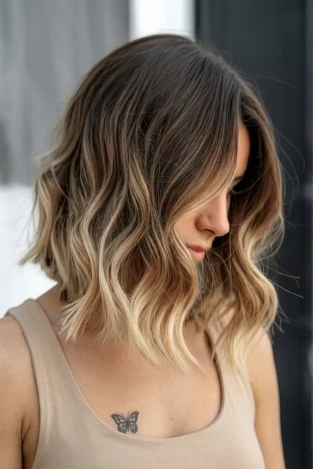 Beautiful blonde wavy bob hairstyle with soft layers, perfect for a modern, stylish look. Ideal for women seeking a versatile and trendy hairdo that enhances natural hair texture.