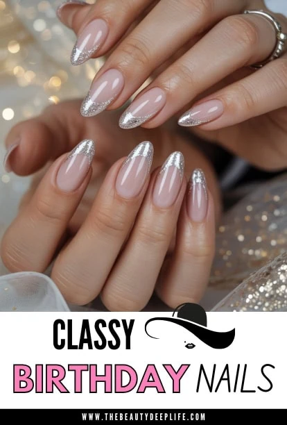 Elegant birthday nails with silver glitter tips on well-manicured hands, showcasing a classy and festive nail design perfect for celebrations and special occasions.