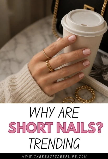 Close-up of a woman's hand with short, well-manicured nails holding a disposable coffee cup, showcasing trendy short nail styles for modern beauty.