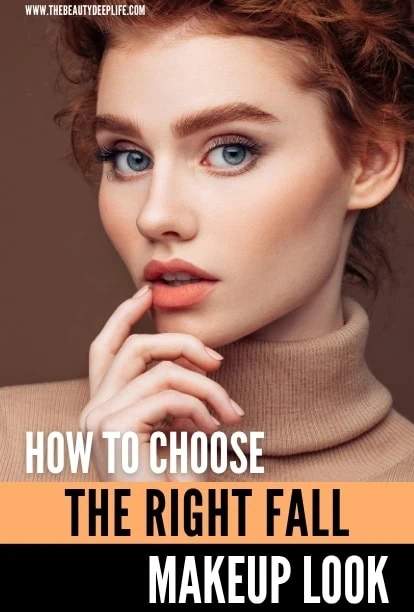 Close-up of a young woman with red hair and blue eyes, wearing a beige turtleneck, demonstrating fall makeup look with natural tones and subtle eye makeup.