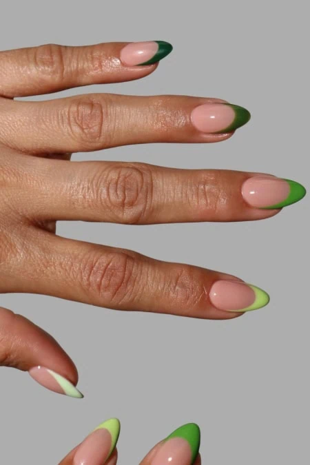 Elegant green and nude nail design with a gradient effect, perfect for all year round, showcasing stylish and trendy nail art.