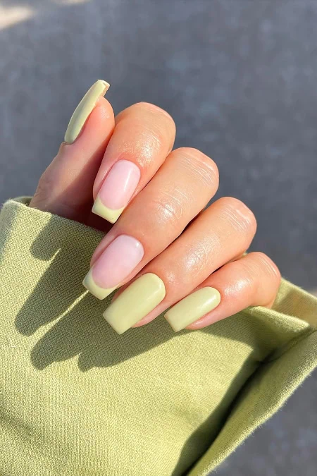 Elegant green and pink ombre nails showcased in natural sunlight, perfect for all year round, from The Beauty Deep Life.
