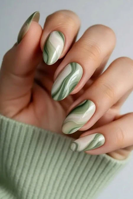 Elegant marble manicure design.