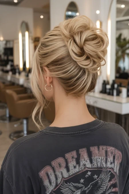 Elegant messy updo hairstyle for medium-length hair, perfect for stylish occasions and showcasing hair texture and volume.