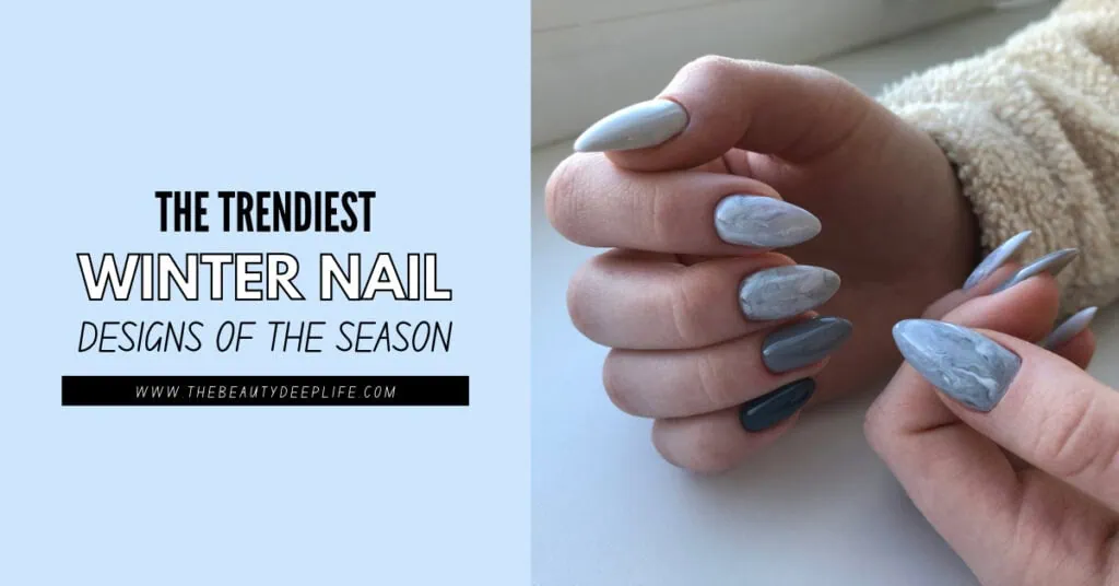 Winter nail designs featuring trendy, marble-style gray and silver nail art perfect for the season, showcased on well-manicured hands.