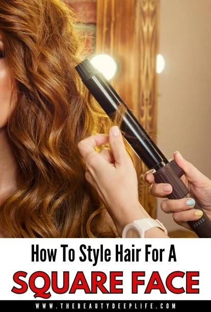 Woman styling her curly hair with a curling iron, focusing on hair texture and styling tools.