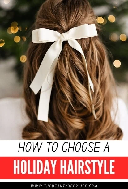 Back view of a woman with long, wavy brown hair tied with a white satin ribbon bow, festive blurred lights in the background, suitable for holiday hairstyle inspiration.